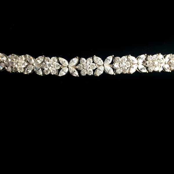 Sparkling Silvertone Bracelet Adorned with Flower Shaped CZs
