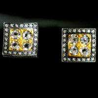 Square white topaz cufflinks set in gold and surrounded by diamonds and silver